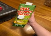 REMIUM 100% BRAZILIAN-> REAL COCONUT WATER Ola Fatocholestero TASTE THE FERENCE Never from concentrate 33.75 FL OZ (1 liter) Natural coconut water