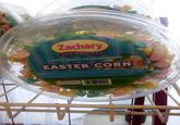 Zachary SINCE 1950 EASTER BUNNY HEADQUARTERS EASTER CORN Nutrition Facts Servings: about 15, Serving size: 17 pieces (30g), Amount per serving: Calories 110 Total Fat 0g 0% DV), Sat. Fat 0g (0% DV). Trans Fat 0g, Cholest. Omg (0% DV), Sodium 30mg (1% DV), Total Carb. 27g (10% DV) Dietary Fiber 0g (0% DV), Total Sugars 22g, Includes 22g Added Sugars (44% DV), Protein 0g. Vit. D Omog (0% DV), Calcium 0mg (0% DV), Iron Omg (0% DV), Potassium 0mg (0% DV). % DV = % Daily Value INGREDIENTS: Sugar, Corn Syrup, Contains Less Than 2% of the Following: Salt, Glycerine, Egg Whites, Confectioner's Glaze Ratural and Artificial Flavors, Mineral Oil, Honey, Carnauba Wax, Vegetabis Oil (Coconut and Canola Oli). Artificial Colors (including FD&C Yellow 85, Blue #1 and Red #3). A ALLERGEN ALENT CONTAINS EG MANUFACTURED IN A FACILITY THAT S PRODUCTS CONTAINING ON MEAT AND PLANETGE SOY MILK MUT INGREDIENTS STORE IN A COOL, DRY PLACE 075186 15110 Manufactured By Zachary Confections, Inc. Frankfort, IN 46041 U.S.A. A Family Owned 5 American Company NET WT 16 oz (1 lb) (454 g)