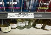 DEAD DOG MD 20 20/20 ERAZZ BLUE RAZZ SAND BLING BLING BLUE RAZZ GRAPE WINE WITH NATURAL FLAVORS AND CERTIFIED COLOR. 200 ML. ALC 15.0% BY VOL MAD DOG BY MD 20/20. BOTTLED BY THE 20/20 WINE CO., ACAMPO, & RIPON, CA. CONTAINS SULFITES GOVERNMENT WARNING:(DACCORDING TO THE SURGEON GET DEFECTS. (2) CONSUMPTION OF AL OF ALCOHOLIC BEVERAGES IMPAIRS YO CAR OR OPERATE MACHINERY. AND MAY CAUSE HEALTH PROBLEM 1) You Are on CAMARA WARNING Steal Jail HOME SUTTER SUTTER HOME TT OM BY MD 20/20 DOG TRAWBERRY ED SUTTE HOME HO SUT CHAER