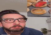 A GIF of the Adam Rose soy face meme. In the GIF he screams loud.