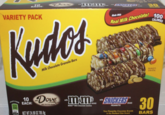VARIETY PACK Kudos Milk Chocolate Granola Bars -SNICKERS Made With 30 Real Milk Chocolate! 100 CALORIES ENLARGED TO SHOW DETAIL with what's inside EACH: Milk Chocolate Drizzle 10 Dove m&m SNICKERS... with BRAND MINISM Milk Chocolate Candies 100 5%OV NET WT 24.90 OZ 705.9g PEANUTS Your Favorite Chocolate Brands in the Perfect Size Snack 30 BARS