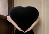A photo of kykyky618 doing the heart butt challenge. She started the trend with this photo.