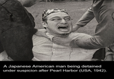 A Japanese American man being detained under suspicion after Pearl Harbor (USA, 1942).