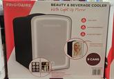DA FRIGIDAIRE BEAUTY & BEVERAGE COOLER With Light Up Mirror COOLER Δ LED LIGHT FRIGIDAIRE A PORTABLE DESIGN (Δ SLIDE OUT SHELF MAKEUP MIRROR WITH RING LIGHT 9 CANS EFBF9008-BLACK MULTI-USE COOLER SKINCARE COOLER: STORE YOUR MOISTURIZERS AND BEAUTY TOOLS INSIDE FOR A REFRESHING TAKE ON YOUR DAILY SKINCARE ROUTINE CAN COOLER: KEEP YOUR DRINKS AND SNACKS ICY COLD 058465 841027 ANS