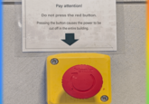 Pay attention! Do not press the red button. Pressing the button causes the power to be cut off in the entire building. Schneider Electric Electri P