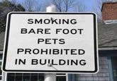 SMOKING BARE FOOT PETS PROHIBITED IN BUILDING