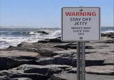 WARNING STAY OFF JETTY WAVES MAY SUCK YOU OFF