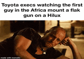 Toyota execs watching the first guy in the Africa mount a flak gun on a Hilux made with mematic