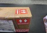 USPS APIS E POSTAGE PAID UND ADVANTAGE OLE WITH CARE THIS SIDE UP all 44 THIS SIDE UP HANDLE WITH CARE HANDLE WITH CARE FRAGILE THANK YOU
