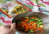 Steamed ASIAN SEASONED AN-BAG STEAM-IN R LOCKED IN FRESHNESS .D6 Medley AND SUGAR SNAP PEAS IN ASIAN SEASONING BROCCOLL CARROTS, BABY COB CORN A G SUGGES EEP FROZE NET WT 12 OZ (340g)
