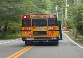 SCHOOL BUS 45934 DREAMENCY DOOR UNLAWFUL TO PASS WHEN RED LIGHTS ARE FLASHING 609 9 BUS STOPS AT ALL RR GROSSINGS KEEP BACK