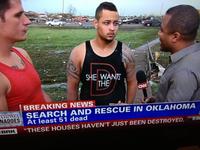 Screenshot captured from CNN on 20 May 2013 while reporting on Moore, OK tornado. Interview was pulled when CNN realized the meaning behind the shirt.