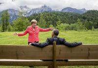 German Chancellor Angela Merkel speaks with U.S. President Barack Obama outside the Elmau castle in Kruen near Garmisch-Partenkirchen, Germany, June 8, 2015. 