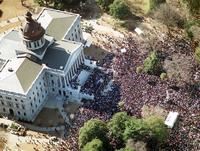 "The State":http://www.thestate.com/news/local/article25302169.html - An estimated 46,000 people marched in downtown Columbia, SC Monday (1/17/2000) protesting the flying of the Confederate flag atop the State House dome. The march and rally, commemorating the life and work of the late Rev. Martin Luther King Jr. , was without any major incidents. The flag has been flying since 1962 when the S.C Legislature raised the flag to celebrate the Civil War centennial. This march is also apparently the one of the largest in South Carolina history.

Photo Credit: ERIK CAMPOS