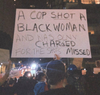 A COP SHOT A BLACK WOMAN NAS OLNY AND CHARGED FOR THE SHOTS MISSED LING