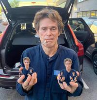 Willem Dafoe Holding Two Willem Dafoes Holding Two Willem Dafoes Holding Two Oranges One Of Them Mol...