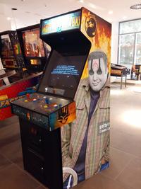 Kevin James Smirking edit placed on a Mortal Kombat 4 arcade machine