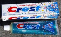 ADIA ACCIATE Cavity Protection Crest NET WT 4.6 OZ (130g) Kid's SparkleFun CAVITY FIGHTING TOOTHPASTE with Fluoristat Cavity Protection Cres NET WTAB ONE (1300) Cavity Protection Crest ITY FIGHTING TOOTHPASTE with Fluoristat Gel FLAVOR Kid's Sparkle Fun Kid's Sparkle Fun Gel FLAVOR Gel