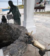 From petting the dog statue