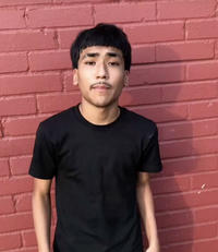 The photo of Latino "Edgar":https://knowyourmeme.com/memes/edgar-edgar-haircut "influencer":https://knowyourmeme.com/memes/social-media-influencer and "TikToker":https://knowyourmeme.com/memes/sites/tiktok Lil G standing in front of a red brick wall, which became a meme on "Twitter / X":https://knowyourmeme.com/memes/sites/twitter-x and "Instagram":https://knowyourmeme.com/memes/sites/instagram in 2025.