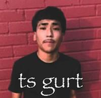 A "meme":https://knowyourmeme.com/memes/memes using the photo of Latino "Edgar":https://knowyourmeme.com/memes/edgar-edgar-haircut "influencer":https://knowyourmeme.com/memes/social-media-influencer and "TikToker":https://knowyourmeme.com/memes/sites/tiktok Lil G standing in front of a red brick wall.