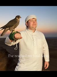 An "AI-generated":https://knowyourmeme.com/memes/cultures/ai-artificial-intelligence edit of the Rick Ross Holding a Hawk in the Desert meme in which the "TikToker":https://knowyourmeme.com/memes/sites/tiktok added himself to the photo.
