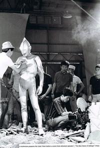 A technician prepares the Color Timer before a scene from Ultraman episode 7, "The Blue Stone of Vallarge" (1966).