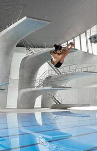 A photoshop of Rubi Rose bending over in a parking garage in front of her Cybertruck. Rubi Rose has been photoshopped as if diving.