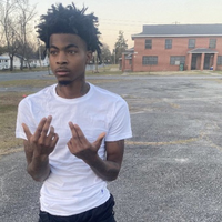 The photo of "rapper":https://knowyourmeme.com/memes/cultures/rap-hip-hop Lazer Dim 700 in the SYBAU meme without the text.