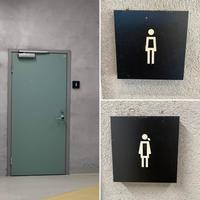 Washroom signs with minimal differentiation