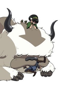 Toph laying on Appa's head as he chews on Sokka