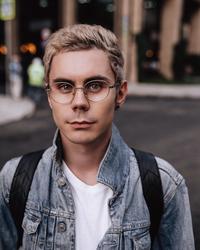 The original photo of "Russian":https://knowyourmeme.com/memes/cultures/russia "influencer":https://knowyourmeme.com/memes/social-media-influencer Ян Топлес (Jan To'ples) known as the Smart Guy With Glasses or Smart Guy in Glasses Wallpaper Download, seen with blonde hair, glasses and jean jacket. The photo went viral on TikTok in 2025.