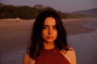 A photograph of actress "Ana de Armas":https://knowyourmeme.com/search?context=&sort=&q=ana+de+armas wearing a red dress on a beach, looking directly into the camera at the viewer. The photo was commonly paired with the "phrasal template":https://knowyourmeme.com/memes/snowclone "*How X Look at Me*," in which the "X" was replaced by a desirable and tempting object, person or concept.