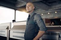 An image of Lex Luther, played by Nicholas Hoult in the 2025 "_Superman_":https://knowyourmeme.com/memes/subcultures/superman-2025-film film, seen standing in an office in a grey suit, scowling as the camera pans.