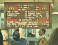M BIG MAC FILET-O-FISH CHEESEBURGER HAMBURGER MILK POUNDER.70 POUNDER 48 LARGE Order Free 33 FRENCH FRIES 28 HOT APPLE PIE 20 COFFEE HOT CHOCOLATE 15 60 M 65 46 7.26 26 15 SHAKES WILLA COFFEE .35 COCA COLA-ROOTBEER-ORANGEADE TRIPPLE RIPPLE ICE CREAM CONE 15&.20 20