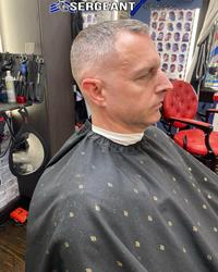 An alternate angle of the Thompson's Cutz and Design's photo "meme":https://knowyourmeme.com/memes/memes, showing a white guy in a barbershop chair at Thompson's Cutz and Design's, located at 133 E US HWY 80, Suite B, Forney, TX 75126.