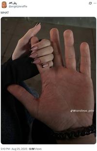 A photo of TikToker karolinaa_priiv holding her boyfriend's hand. A tweet sharing the image reads, "WHAT."