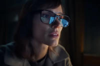 A blank "meme":https://knowyourmeme.com/memes/memes template of Jessica Chastain looking at a computer from the upcoming Apple TV+ show _The Savant_. She's a white woman, seen sitting in a dark room, wearing glasses, with a computer or laptop screen visible in a reflection.