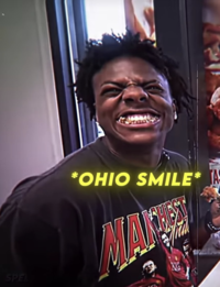A "reaction image":https://knowyourmeme.com/memes/reaction-images that's a screenshot of an "IShowSpeed":https://knowyourmeme.com/memes/people/ishowspeed edit in which he's smiling with the caption, ==*Ohio Smile*==.