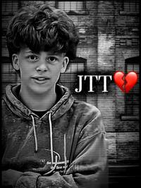 A Johntontraviontavious "meme":https://knowyourmeme.com/memes/memes, showing the white kid in a black and white filter and a caption reading, "JTT 💔," following the template of the "SYBAU Guy":https://knowyourmeme.com/memes/sybau-picture-sybau-guy meme.