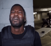 A "GIF":https://knowyourmeme.com/memes/cultures/gif of a black male security guard crying and acting scared as a man is seen in the background getting beaten up, or jumped, by other men. The GIF was originally shared as a "viral video":https://knowyourmeme.com/memes/viral-videos on "Twitter / X":https://knowyourmeme.com/memes/sites/twitter-x by RDCWorld member Mark Phillips.