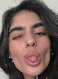 A photo of a woman from "Pinterest":https://knowyourmeme.com/memes/sites/pinterest seen with cowlick eyebrows.