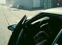 You can see the camera operator in the rear view mirror in Tenet (2020)