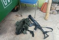 Toy rifle with the words, "14 words. For Agartha," "Brenton Tarrant," written on it, alongside other names of mass shooters like Alexandre Bissonnette and Luca Traini.