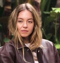 A "meme":https://knowyourmeme.com/memes/memes template of actress "Sydney Sweeney":https://knowyourmeme.com/memes/people/sydney-sweeney staring at GQ interviewer Katherine Stoeffel.
