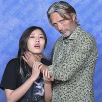 A photo of Mads Mikkelsen play-choking a fan. The photo went viral in 2021.