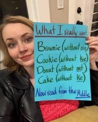 A meme of a woman holding up a sign. The sign has some engagement bait written on it.