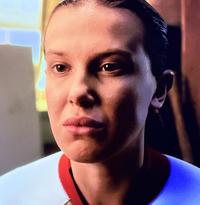 An image of Eleven's face from Stranger Things season 5. The face has been called a Chad face or mewing face.