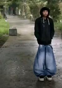 A photo of a Filipino guy in an hourglass-like outfit.