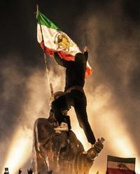 Lion and Sun Flag atop an Islamic Republic clerical statue in Khorramabad 